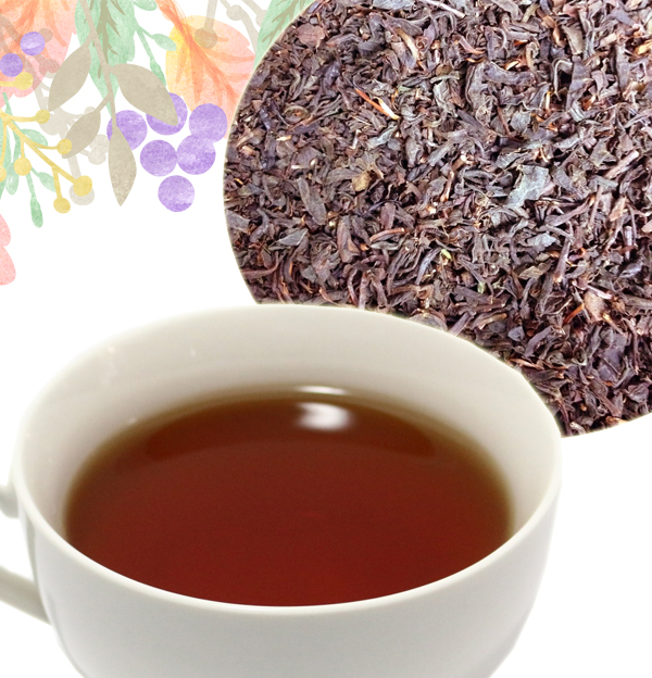 Cup of reddish-brown black tea with dark tea leaves